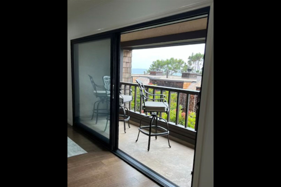 A sliding door and three chairs