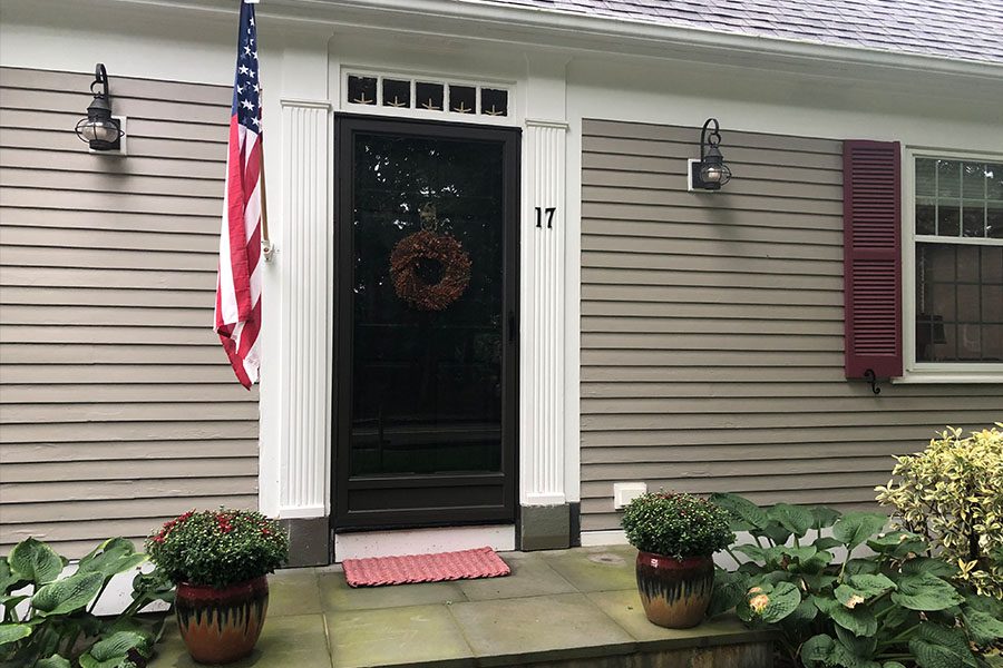 A US flag beside a door